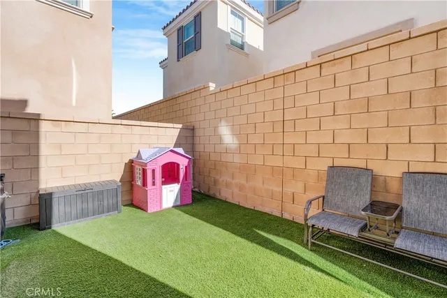 a view of a two chairs in the patio