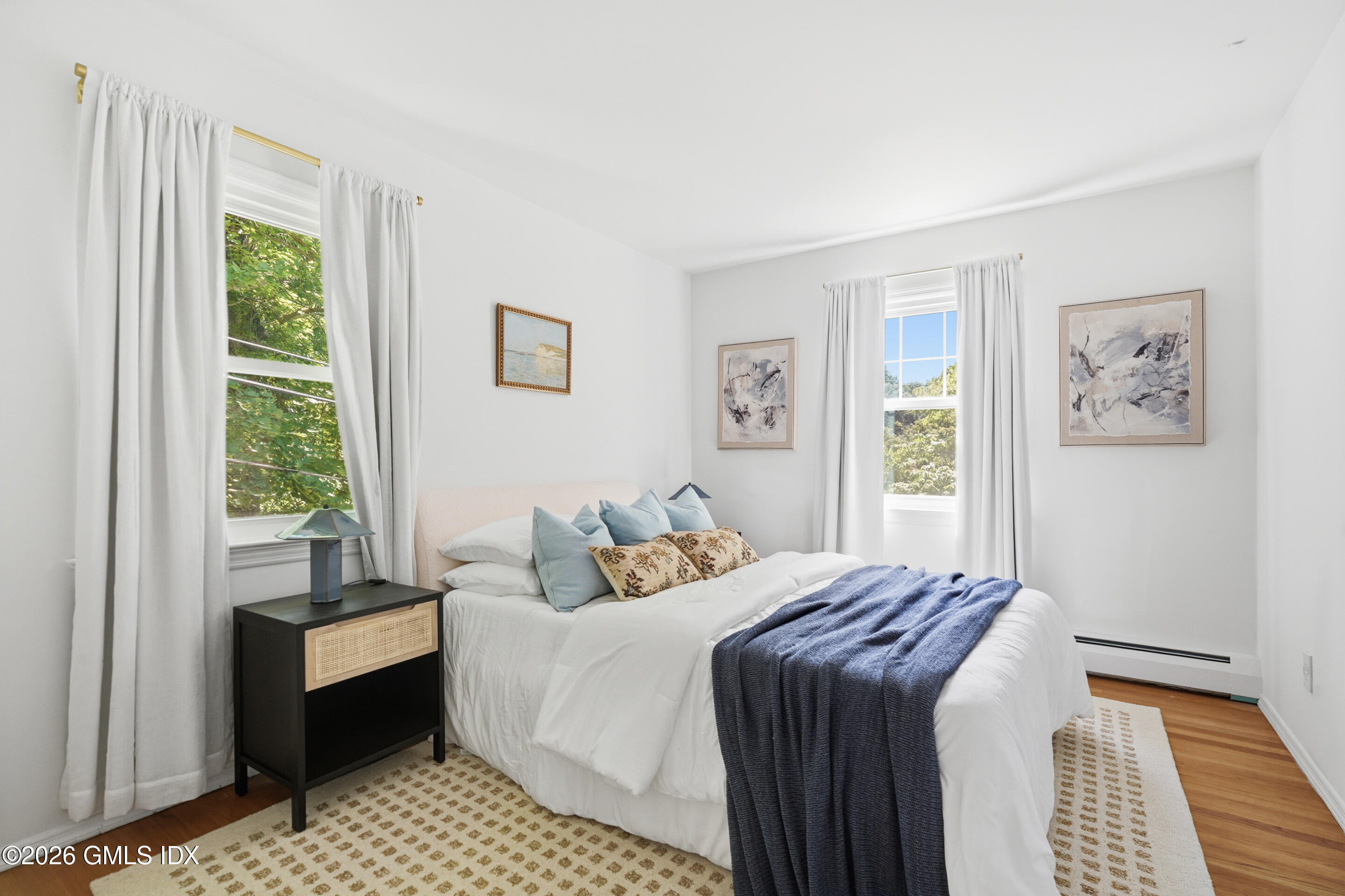 33 Sachem Road Greenwich, CT 06830 - Photo 14 of 35 a bedroom with a bed and a couch