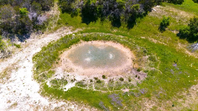 a view of a lake with a big yard