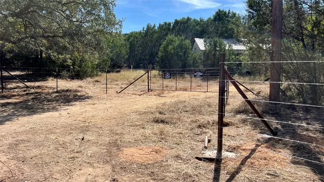 a backyard of a house with trees