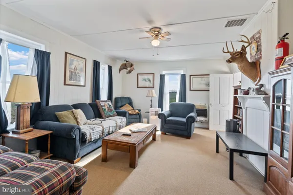 a spacious bedroom with a bed a table and chair