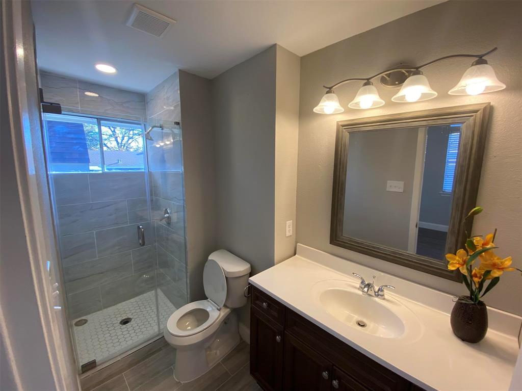 2006 West Northgate Drive Irving, TX 75062 - Photo 20 of 26 a bathroom with a sink toilet and shower