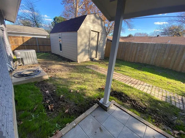 a view of a back yard from a balcony
