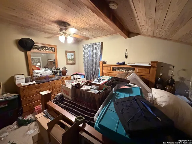 a bed room with furniture and gym equipment