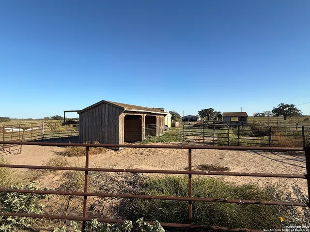 a view of a backyard of the house