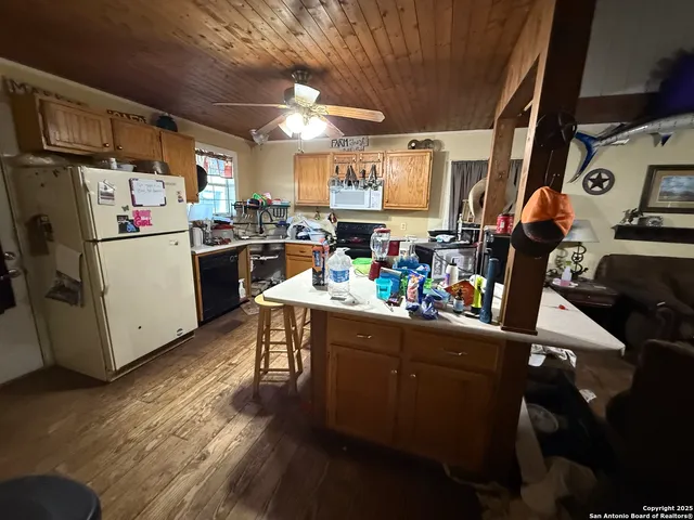 a living room with furniture a rug and a window