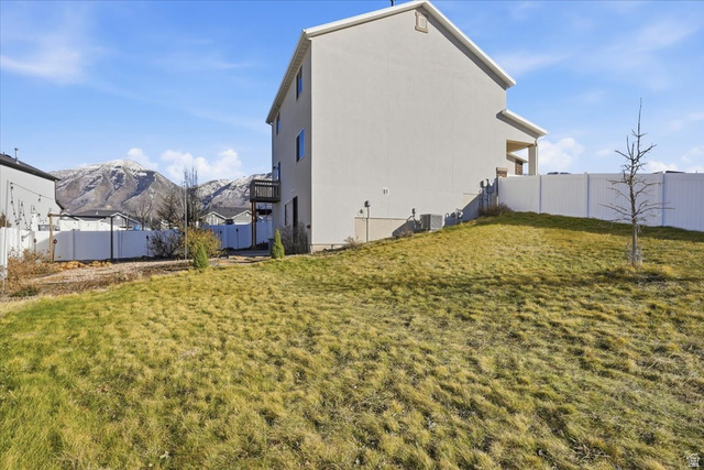 1218 Moonlight Drive Elk Ridge, UT 84651 - Photo 37 of 44 Fenced backyard featuring a mountain view