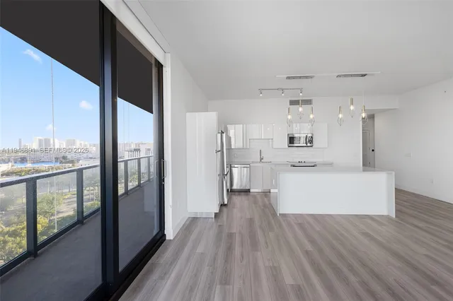 a bathroom with a granite countertop sink a toilet and a shower