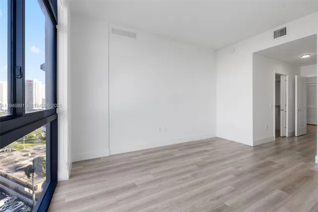 a spacious bathroom with a double vanity and a shower