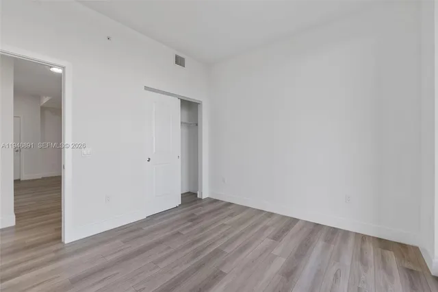 a room with furniture a flat screen tv and a large window