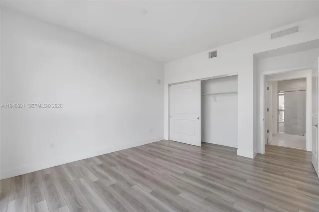 a kitchen with a table and chairs in it