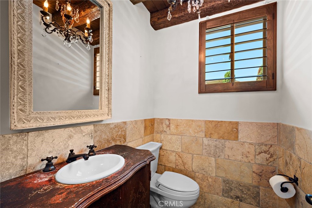 5 Via Monarca Street Dana Point, CA 92629 - Photo 35 of 64 a bathroom with a sink toilet and mirror