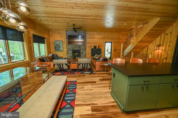 a outdoor living space with furniture and a fireplace