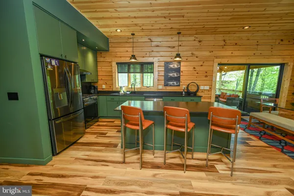 a view of a balcony with wooden floor and door