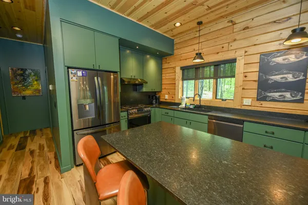 a spacious bedroom with a bed and a chandelier