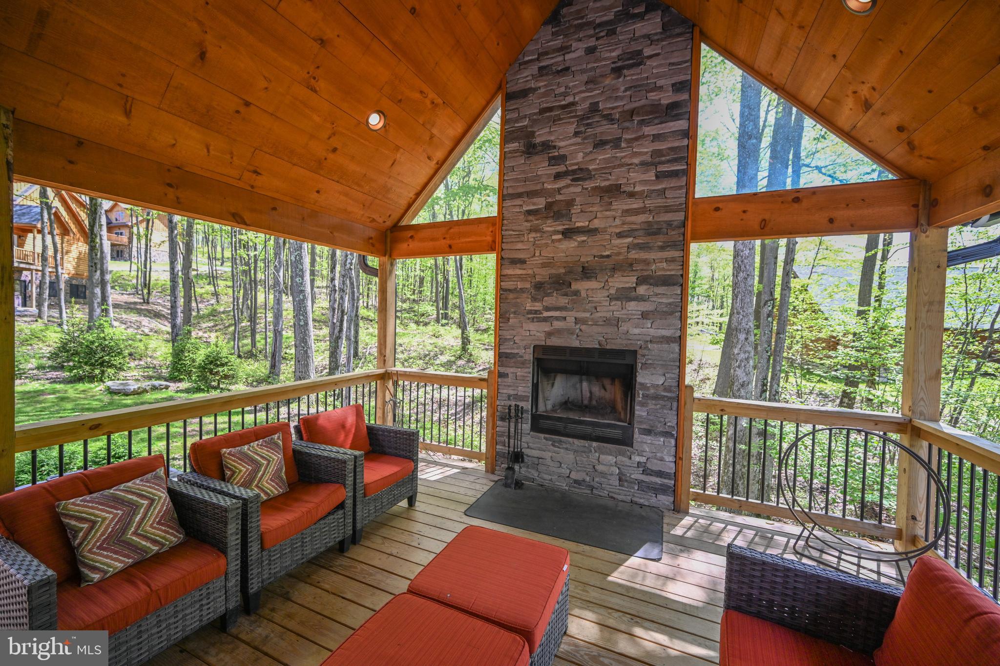 1067 North Camp Road McHenry, MD 21541 - Photo 19 of 81 a balcony with furniture and a fireplace