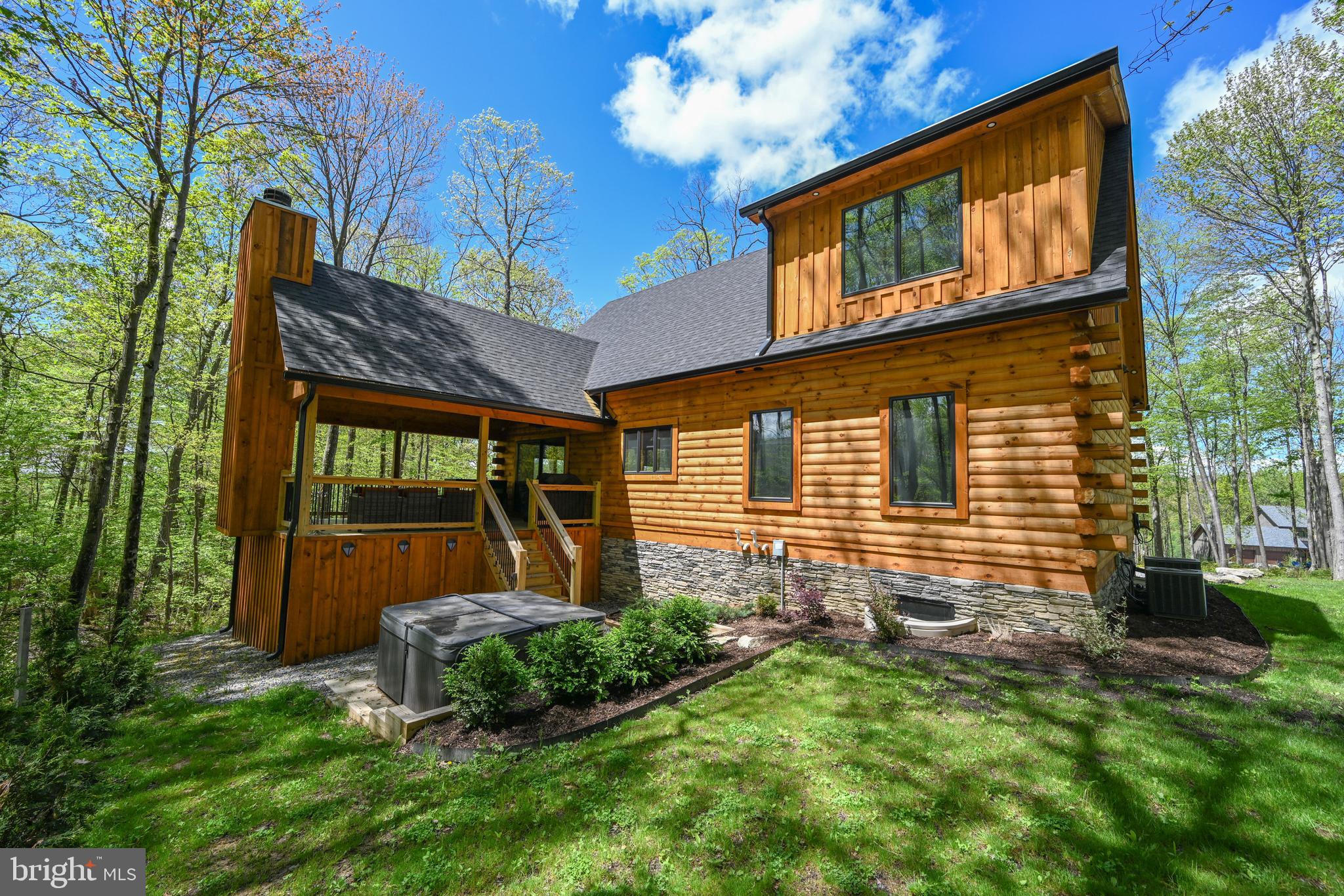 1067 North Camp Road McHenry, MD 21541 - Photo 2 of 81 a front view of a house with garden