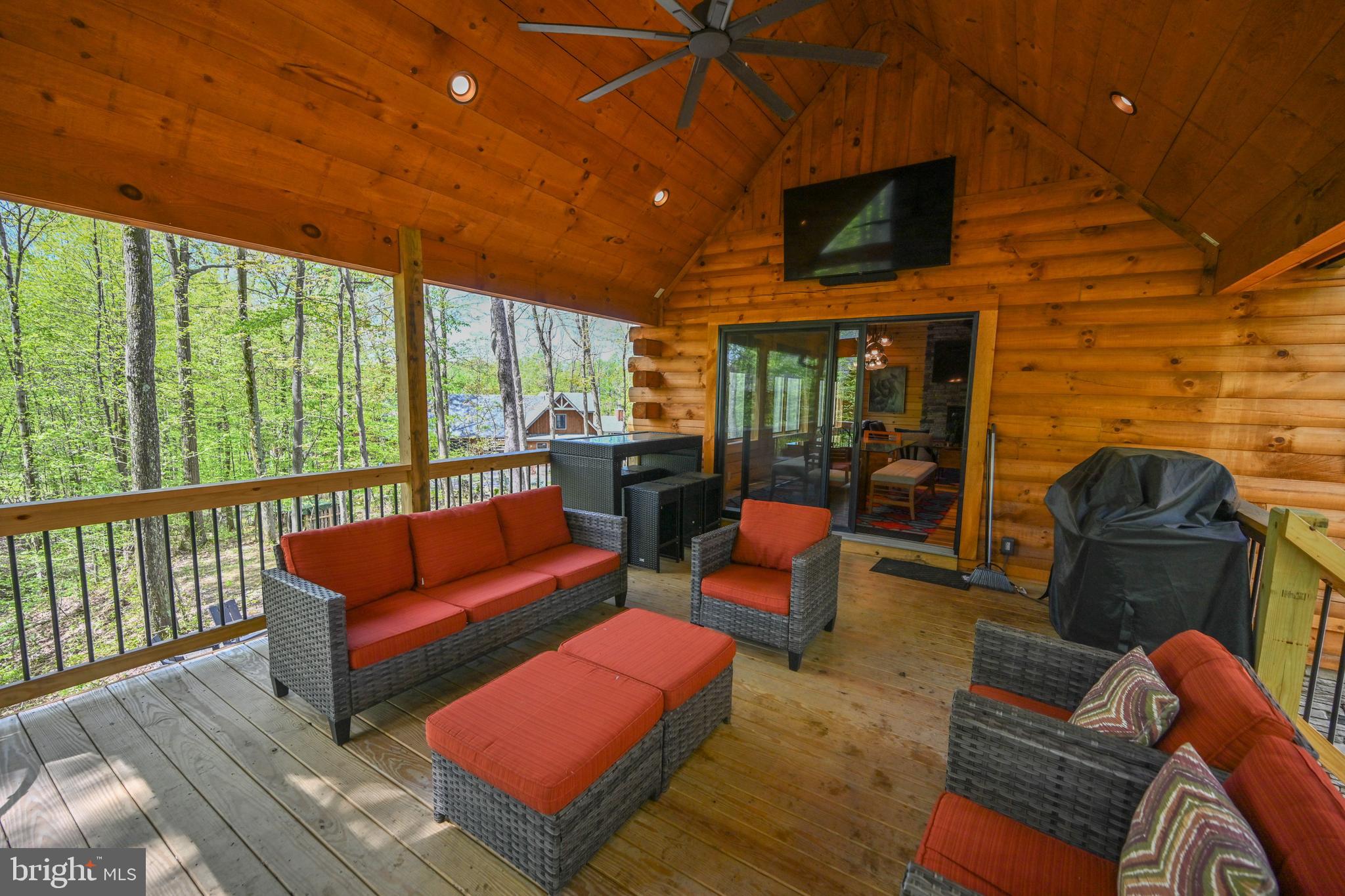 1067 North Camp Road McHenry, MD 21541 - Photo 21 of 81 a outdoor living space with furniture and a fireplace