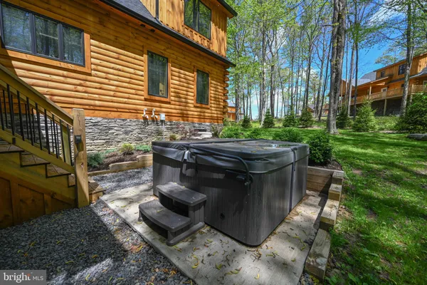 a bathroom with a toilet and a mirror