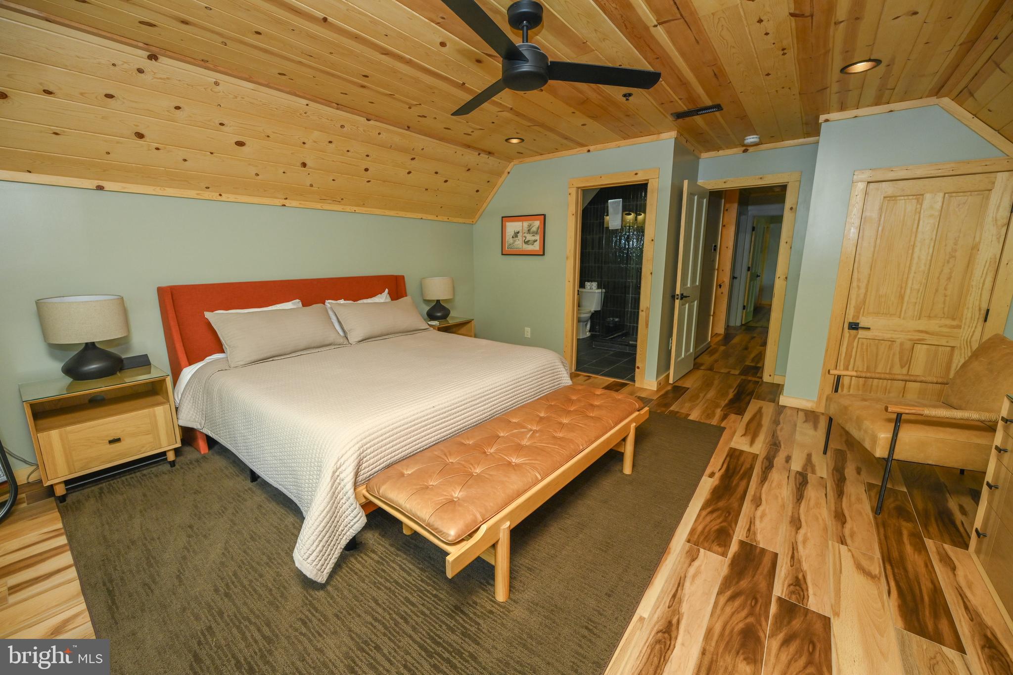 1067 North Camp Road McHenry, MD 21541 - Photo 27 of 81 a bed sitting in a spacious bedroom next to a window