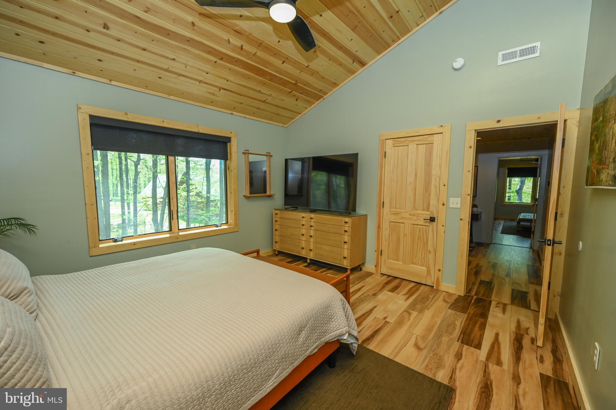 1067 North Camp Road McHenry, MD 21541 - Photo 34 of 81 a bedroom with a bed and a large window