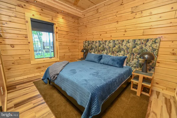 a bedroom with a bed and a dresser