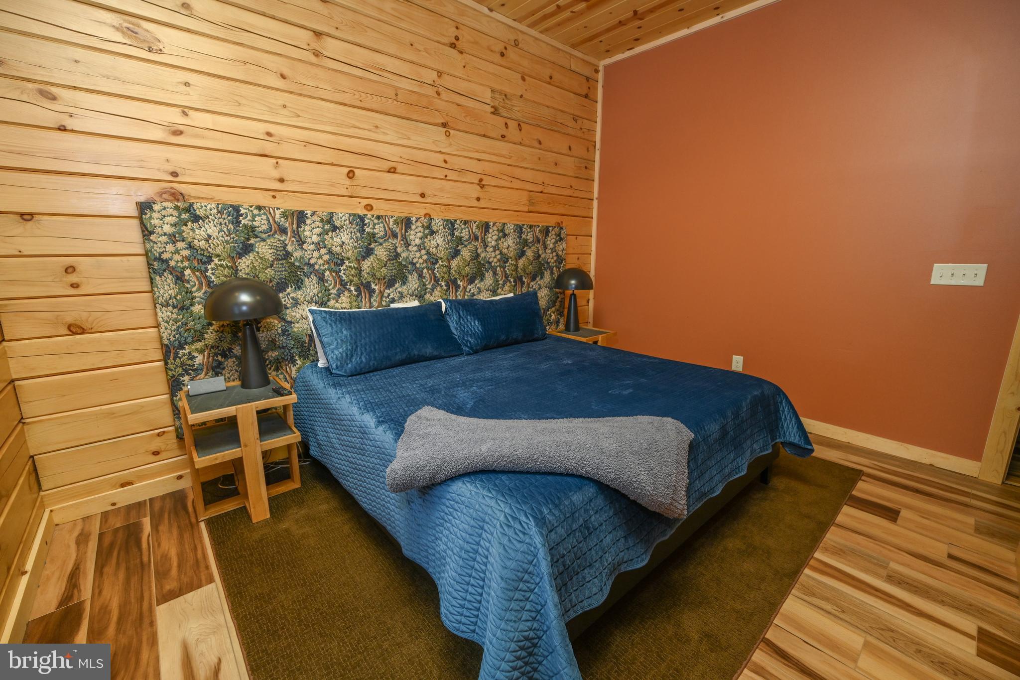 1067 North Camp Road McHenry, MD 21541 - Photo 42 of 81 a bedroom with a bed and a table