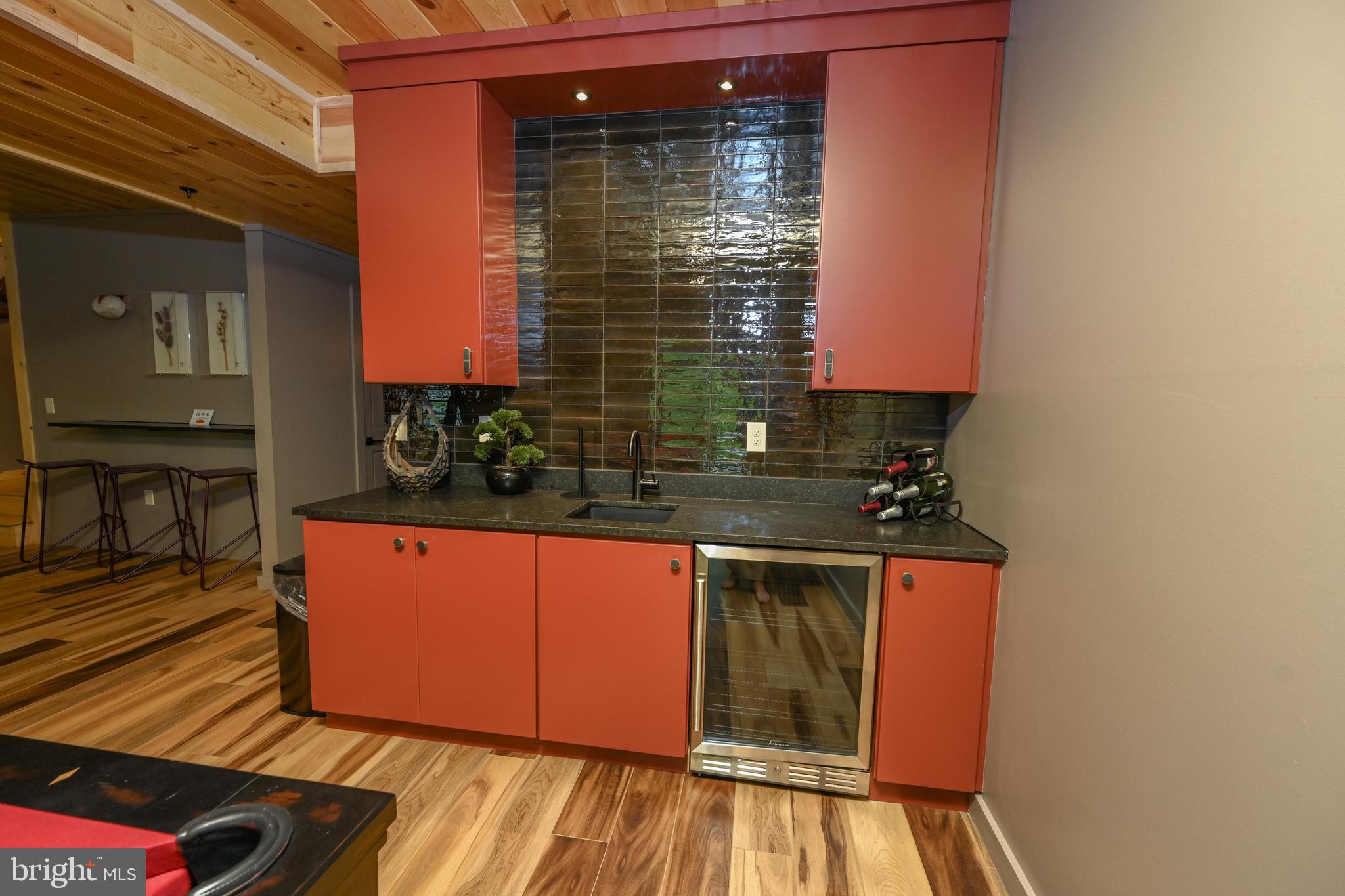 1067 North Camp Road McHenry, MD 21541 - Photo 59 of 81 a kitchen with stainless steel appliances granite countertop a stove a sink and a microwave