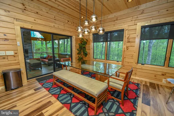 a balcony with furniture and a fireplace