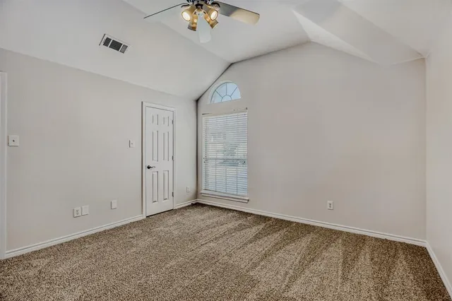 a view of an empty room with a bathroom