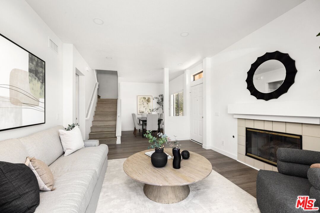4140 Brookcrest Court Moorpark, CA 93021 - Photo 4 of 27 a living room with furniture and a fireplace