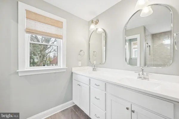 a spacious bedroom with a large bed and a window