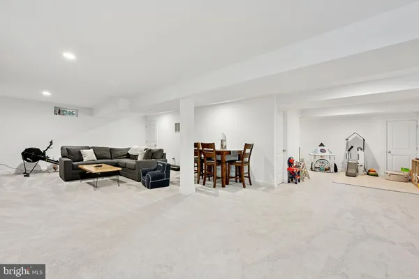 a view of a livingroom with furniture and white walls