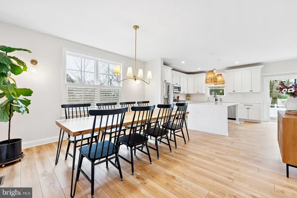 a dining room with furniture window wooden floor