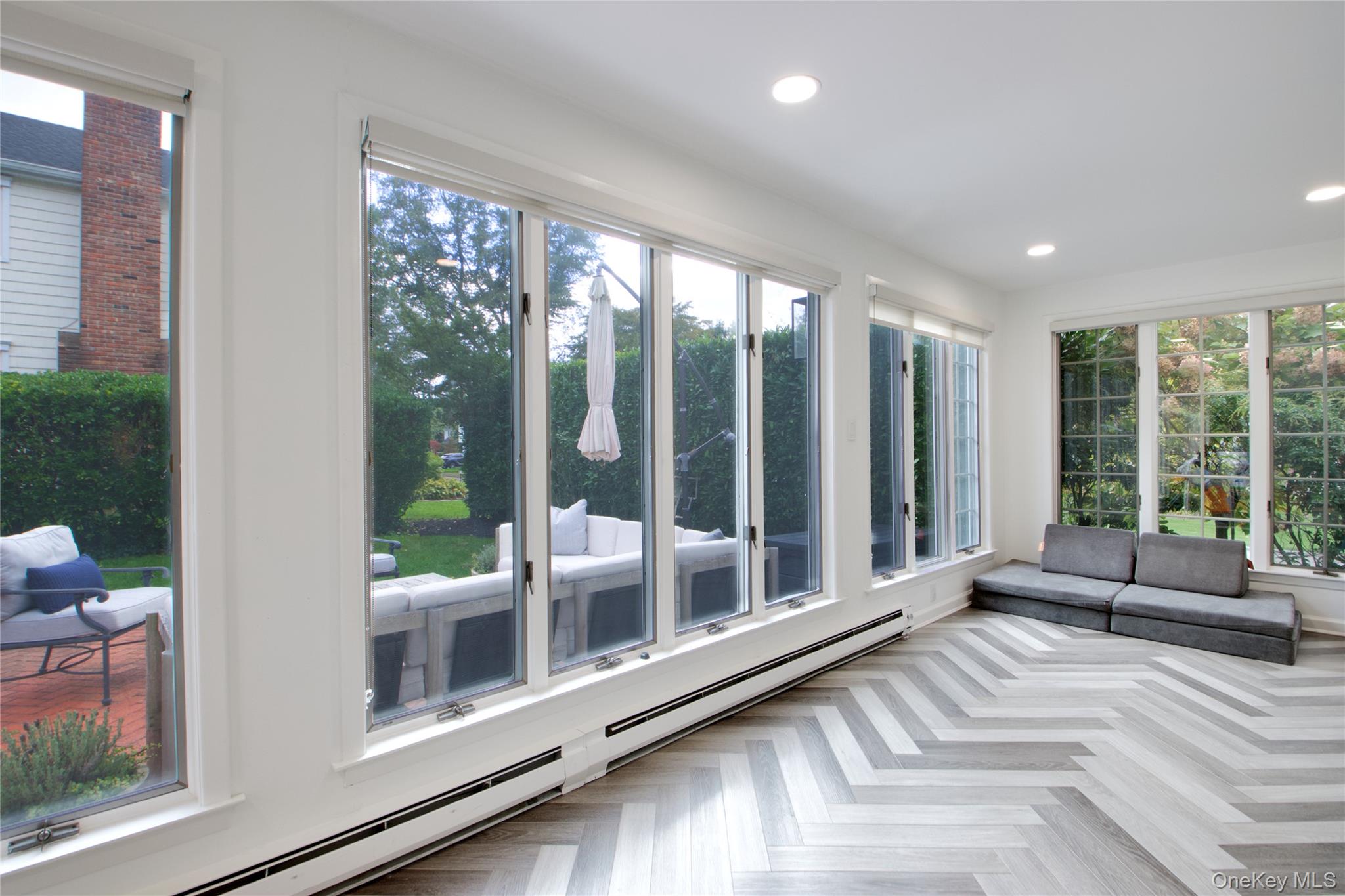 60 Thayer Road Manhasset, NY 11030 - Photo 12 of 28 a view of a living room and floor to ceiling window