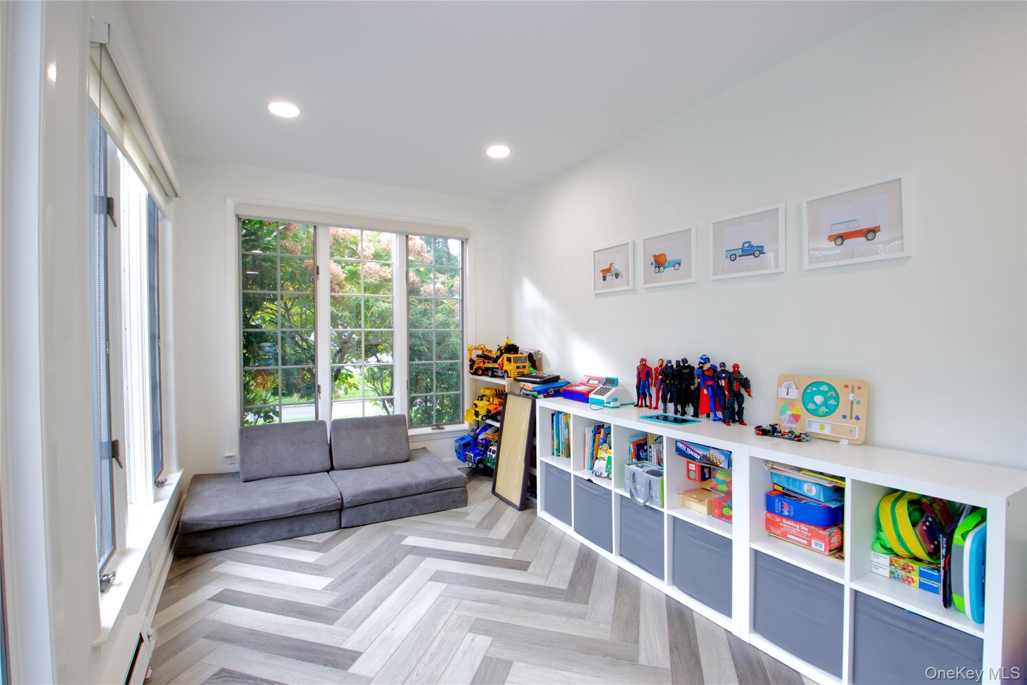 60 Thayer Road Manhasset, NY 11030 - Photo 13 of 28 a living room with furniture and a book shelf