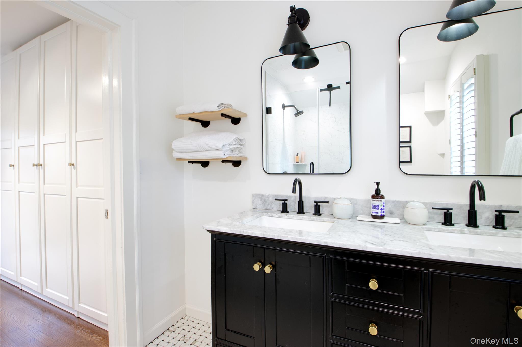 60 Thayer Road Manhasset, NY 11030 - Photo 20 of 28 a bathroom with a sink and a mirror