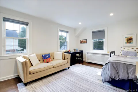 a bathroom with a sink toilet a mirror and bathtub