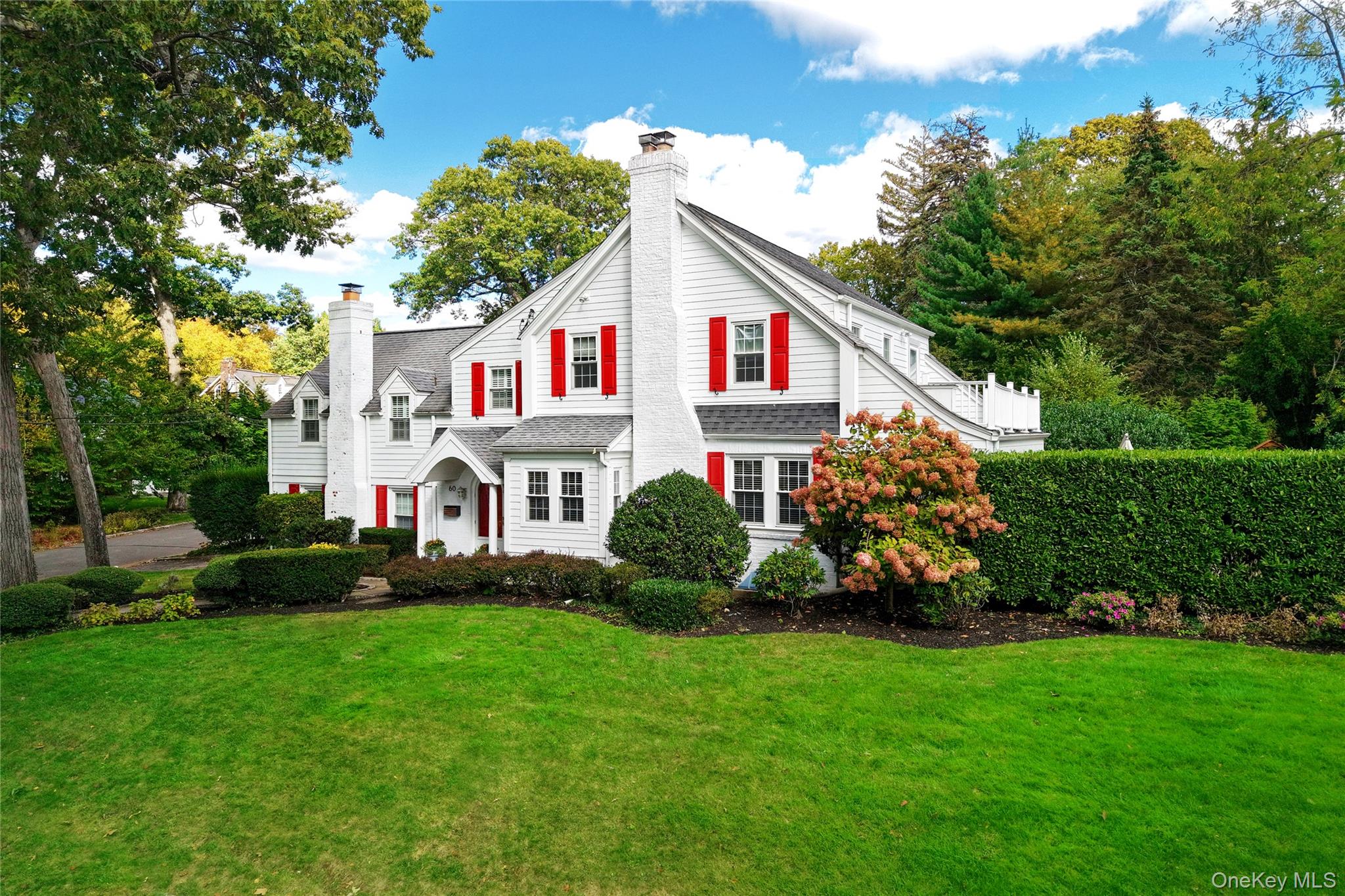 60 Thayer Road Manhasset, NY 11030 - Photo 3 of 28 a front view of a house with garden