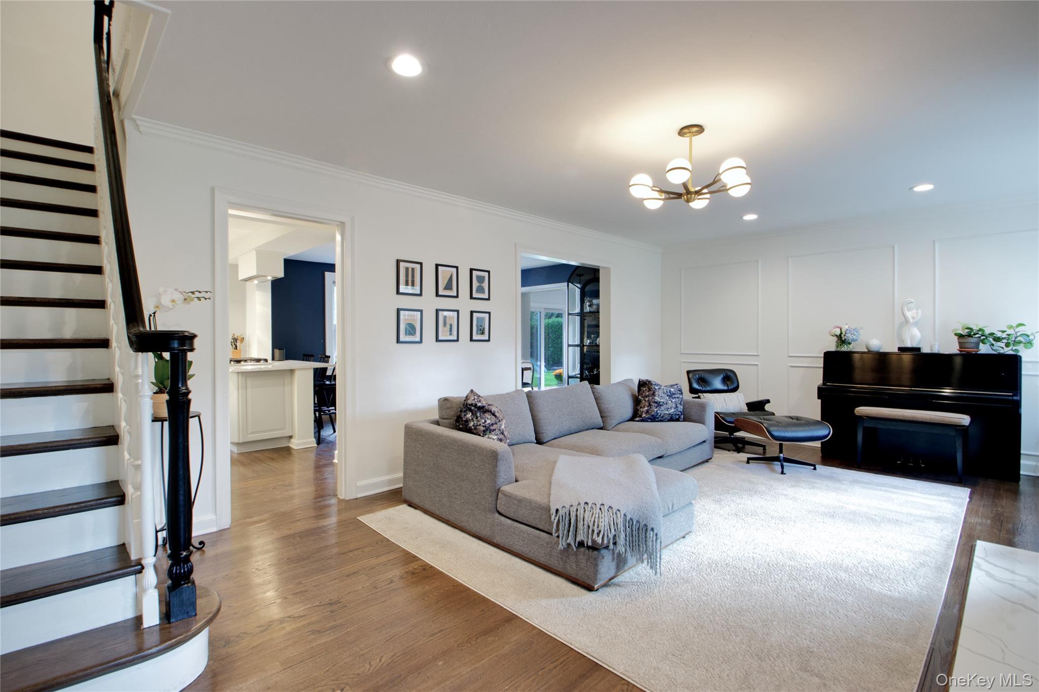 60 Thayer Road Manhasset, NY 11030 - Photo 4 of 28 a living room with furniture a lamp and a chandelier