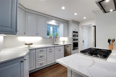 a kitchen with a sink stove and refrigerator