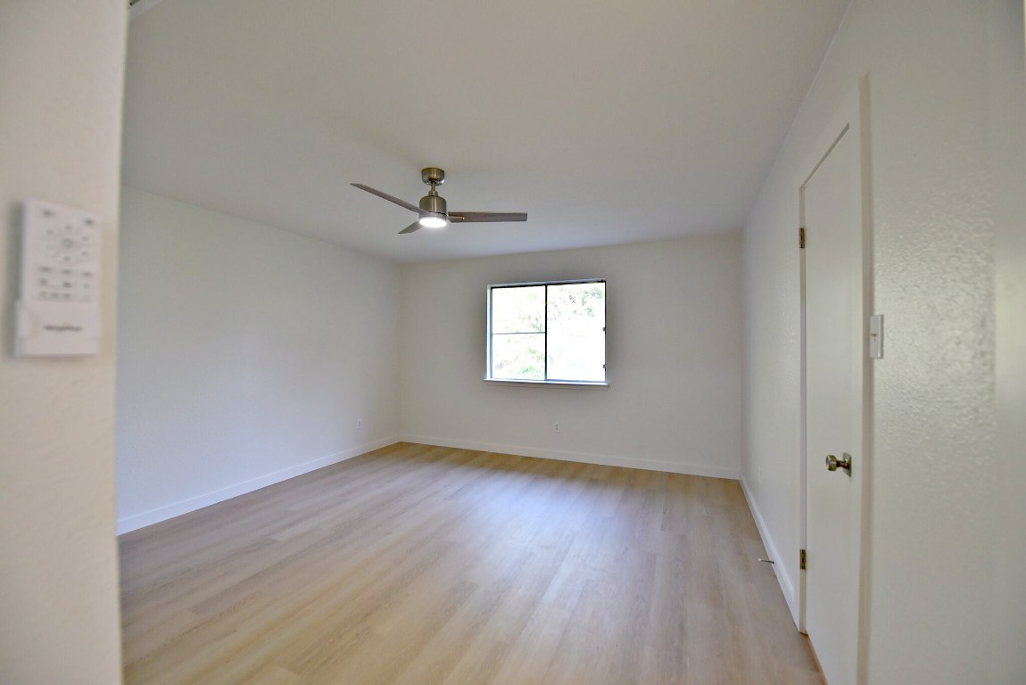 4617 Sidereal Drive Austin, TX 78727 - Photo 15 of 23 wooden floor in an empty room with a window