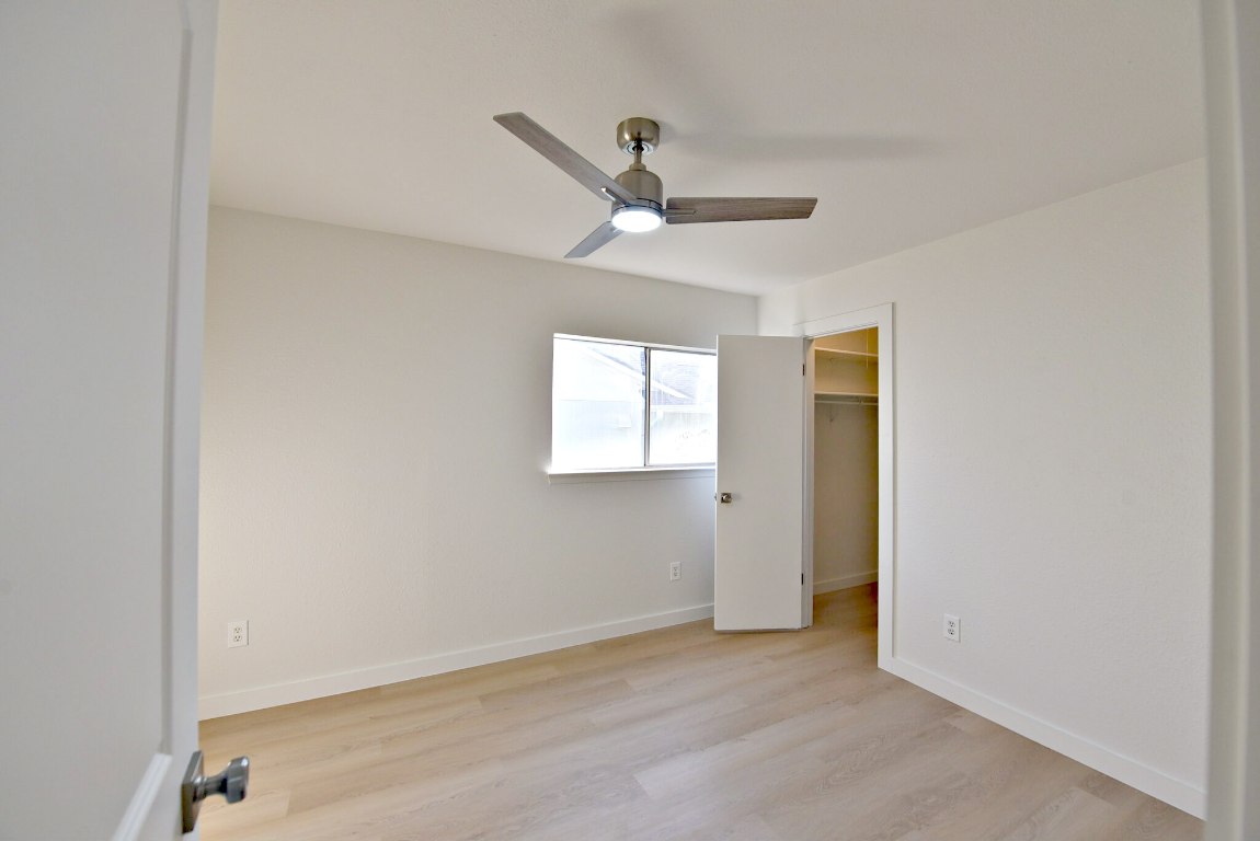 4617 Sidereal Drive Austin, TX 78727 - Photo 20 of 23 an empty room with a window and a ceiling fan