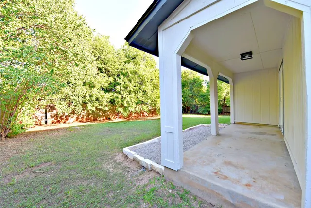 a view of a garden with an outdoor space