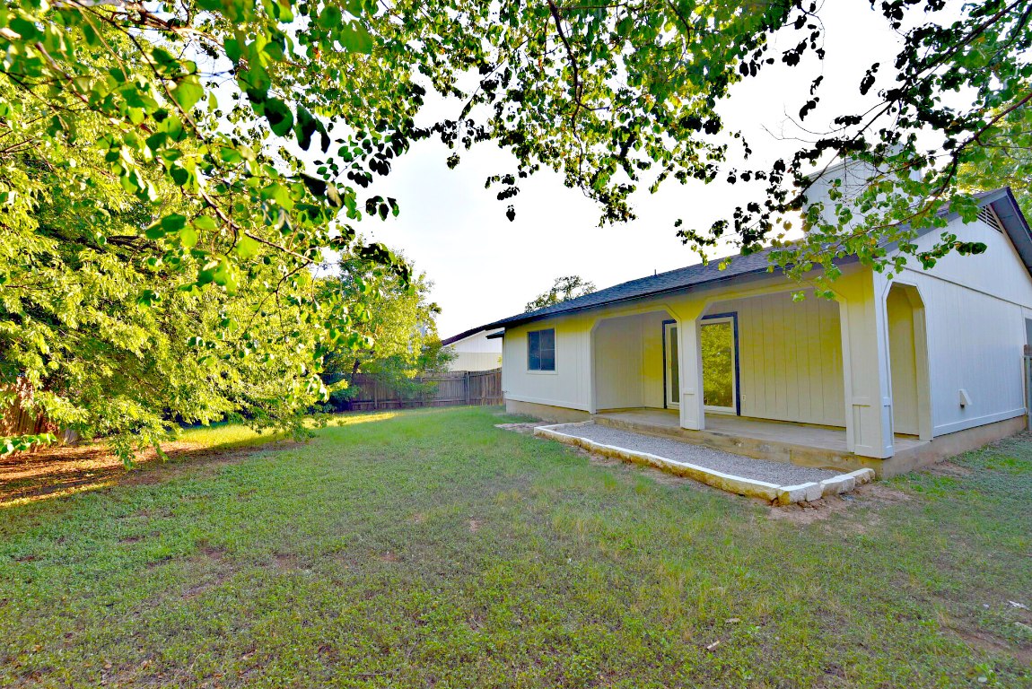4617 Sidereal Drive Austin, TX 78727 - Photo 23 of 23 a view of a yard in front of a house with large tree