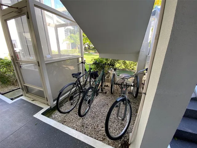 a view of a room with furniture and window