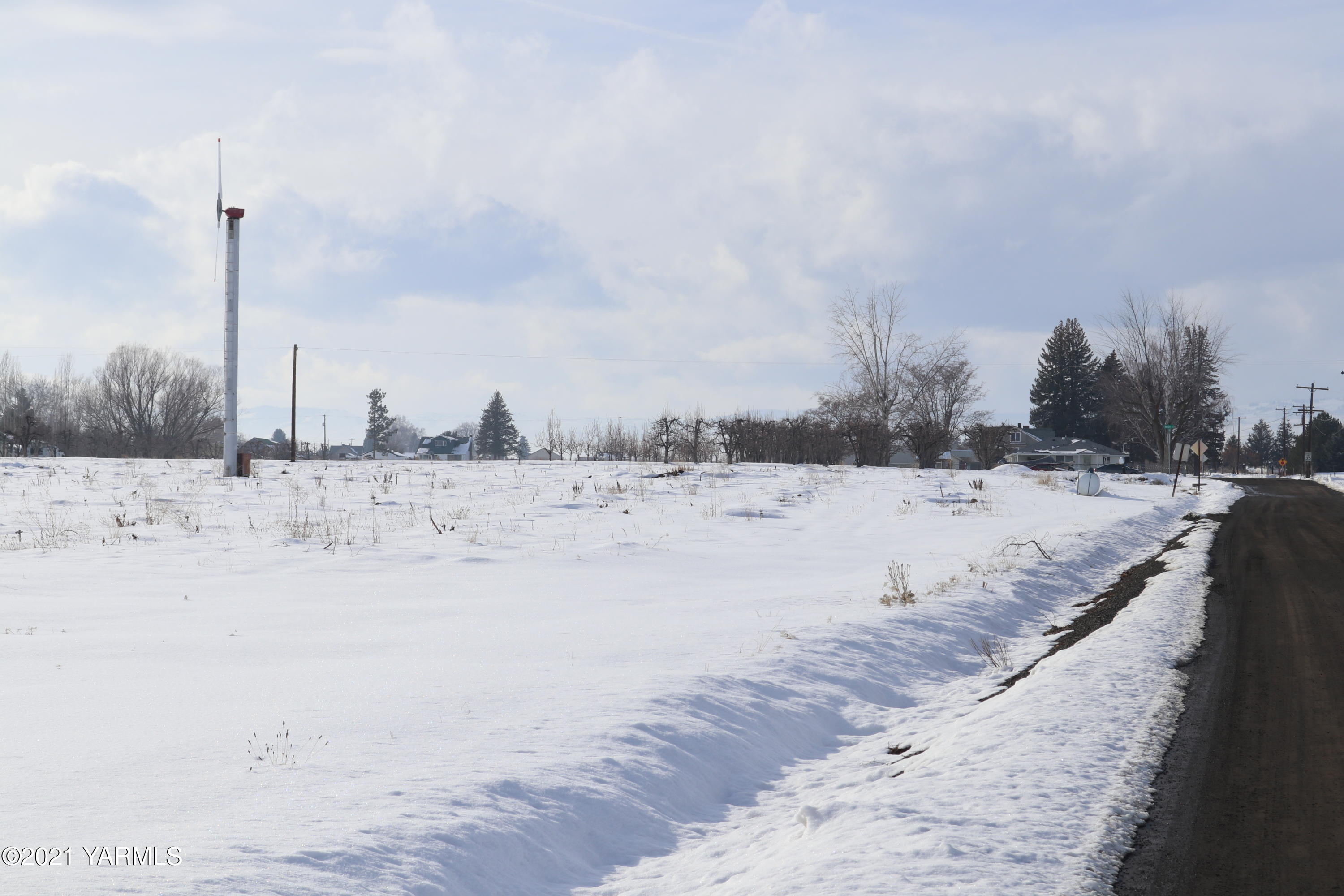 Nka Nka Nelson Road, Unit 1 Yakima, WA 98903 - Photo 21 of 36 a view of a dry yard with snow on the road