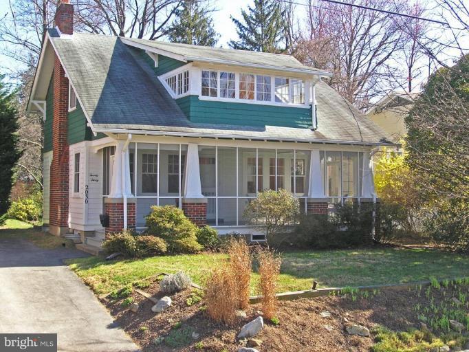 2030 Glen Ross Road Silver Spring, MD 20910 - Photo 1 of 23 a view of a brick house with a yard plants and large tree