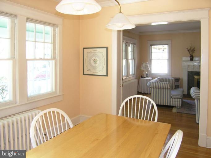 2030 Glen Ross Road Silver Spring, MD 20910 - Photo 19 of 23 a bedroom with a bed and a chandelier