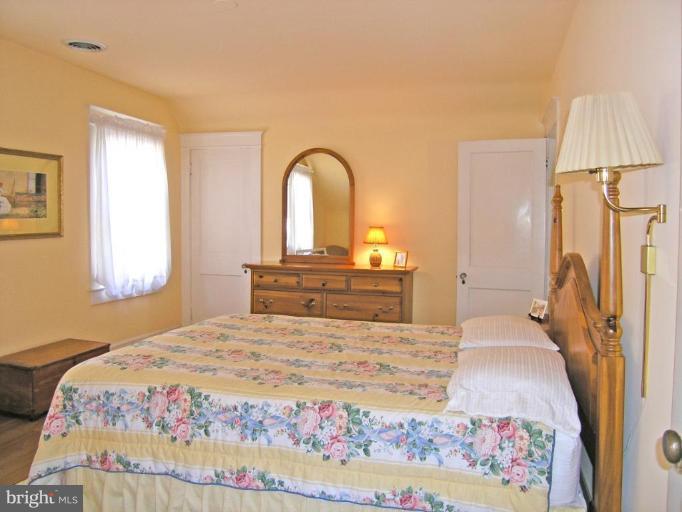 2030 Glen Ross Road Silver Spring, MD 20910 - Photo 8 of 23 a bedroom with a bed and a dresser